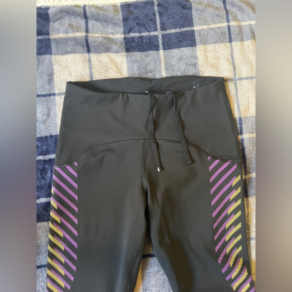 Nike Black Leggings with Purple and Yellow Diagonal Stripe Accents - Picture 4 of 10